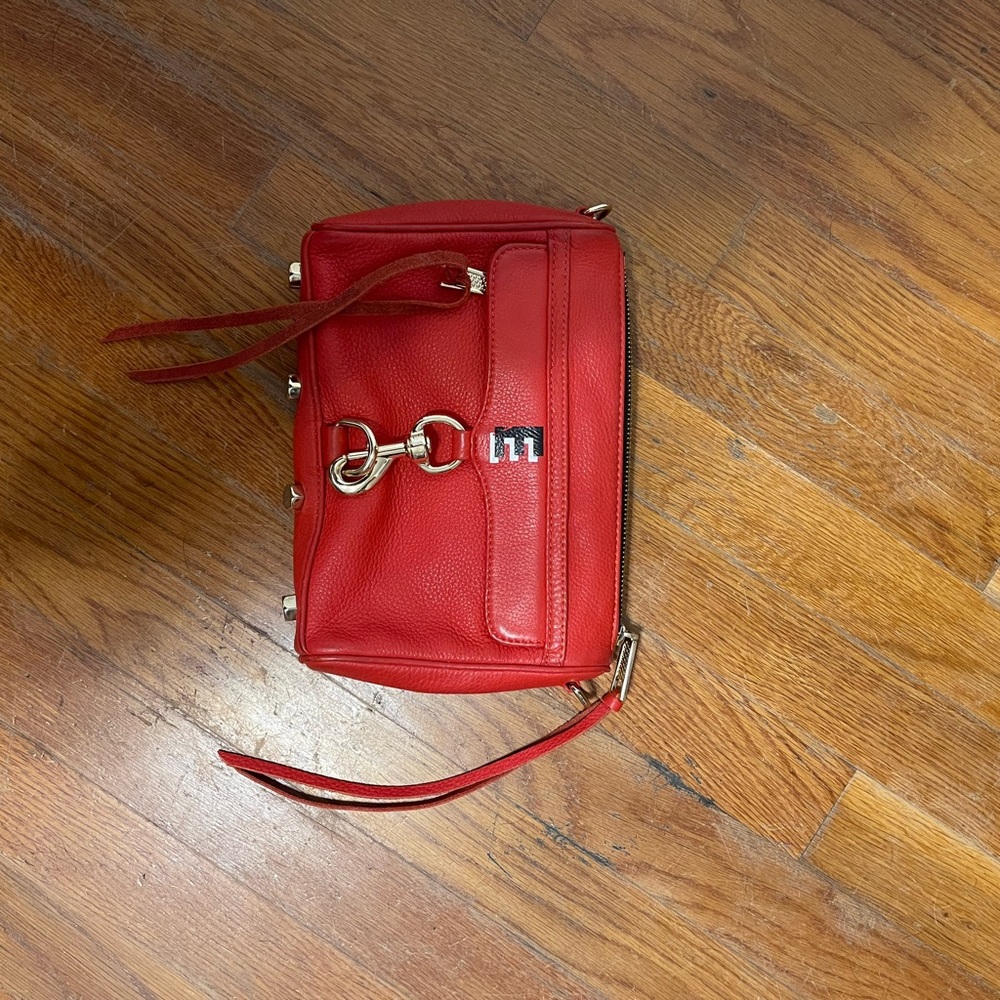 Used red and black Rebecca Minkoff clutch, fair condition